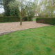 Large front garden with gravel driveway