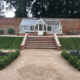 Greenhouse and steps in a large walled kitchen garden