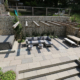 A large contemporary multilevel garden seating area and hot tub