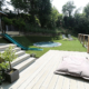 A large contemporary multilevel garden decking and steps