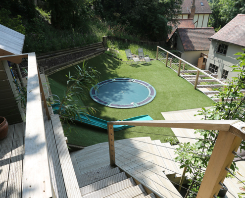 A large contemporary multilevel garden decking and steps