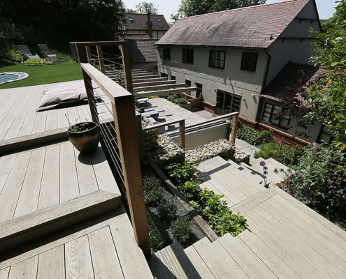 A large contemporary multilevel garden decking and steps