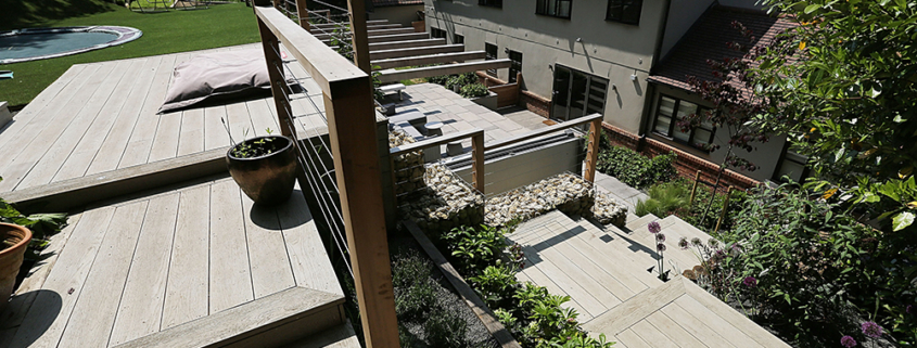 A large contemporary multilevel garden decking and steps