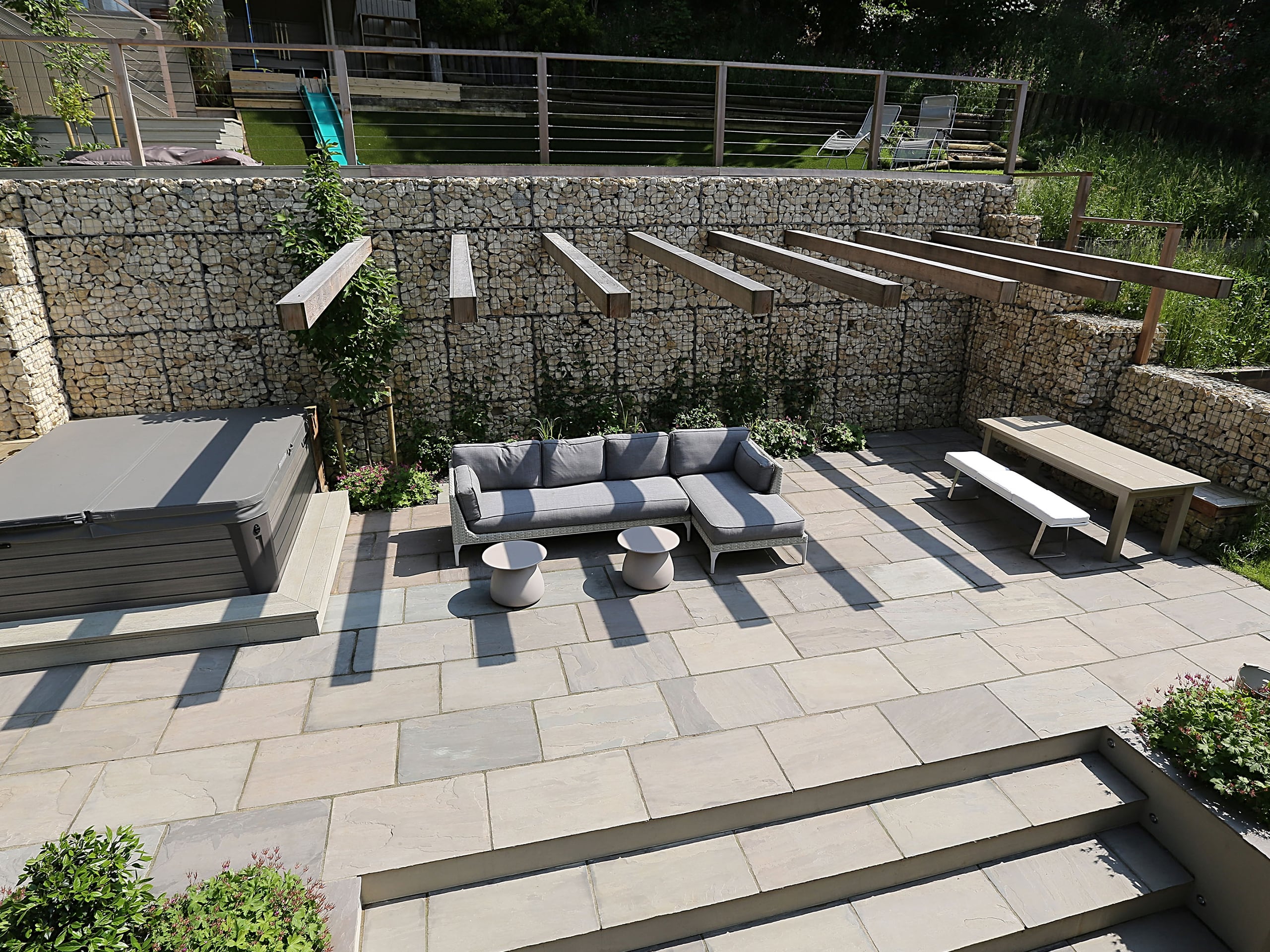 A boulder rock retaining wall and sunken seating area